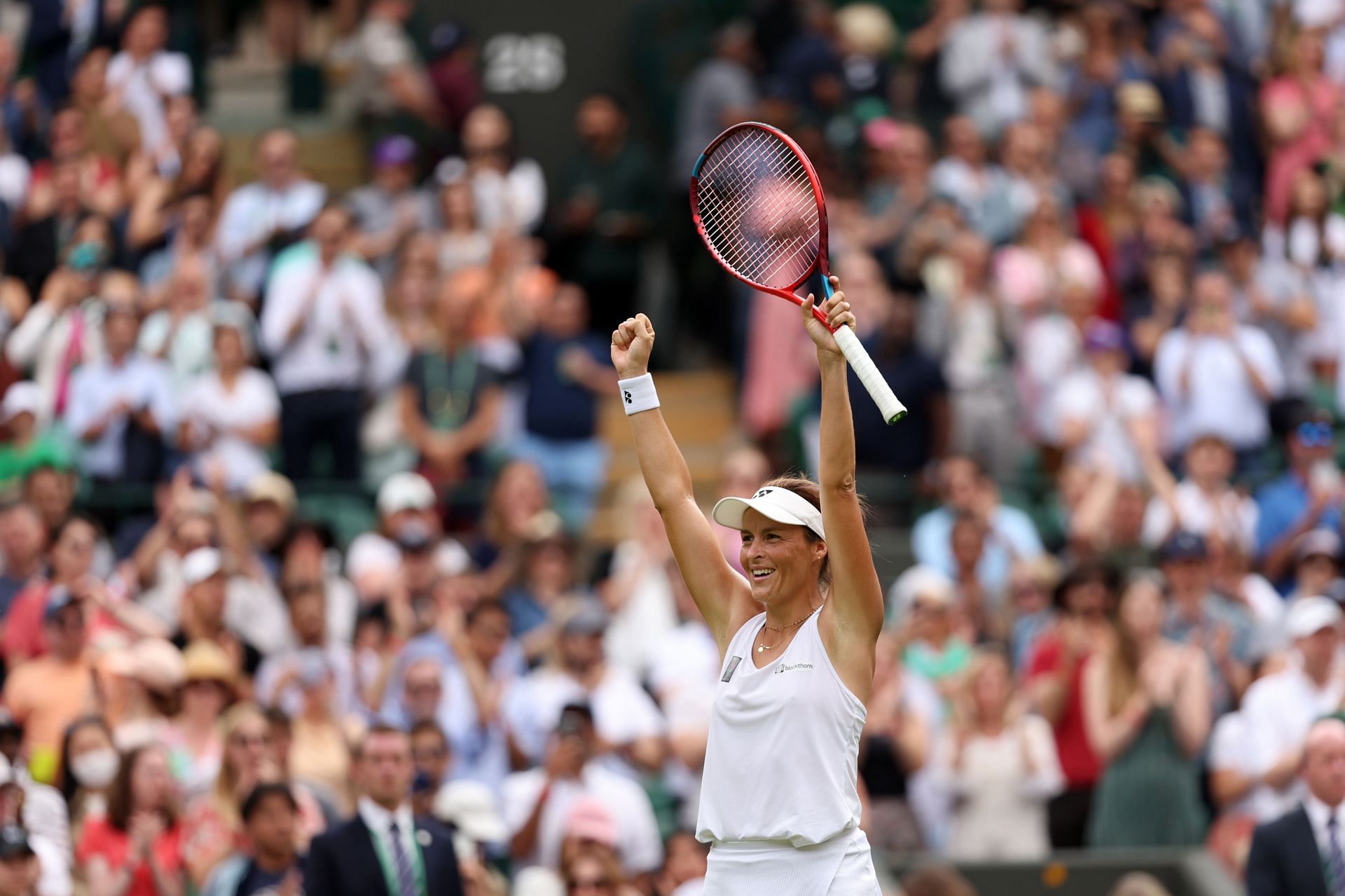 Tatjana Maria celebrates after defeating Jelena Ostapenko at Wimbledon 2022.