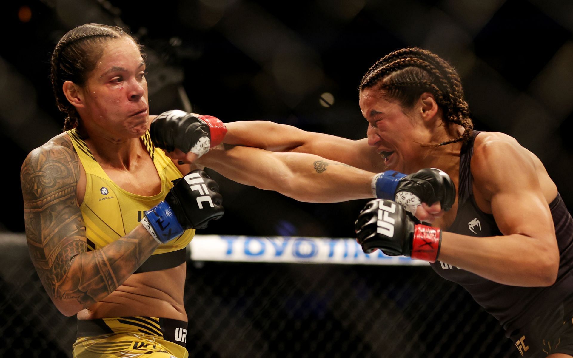 Amanda Nunes (left) and Julianna Pena (right) in action at UFC 277