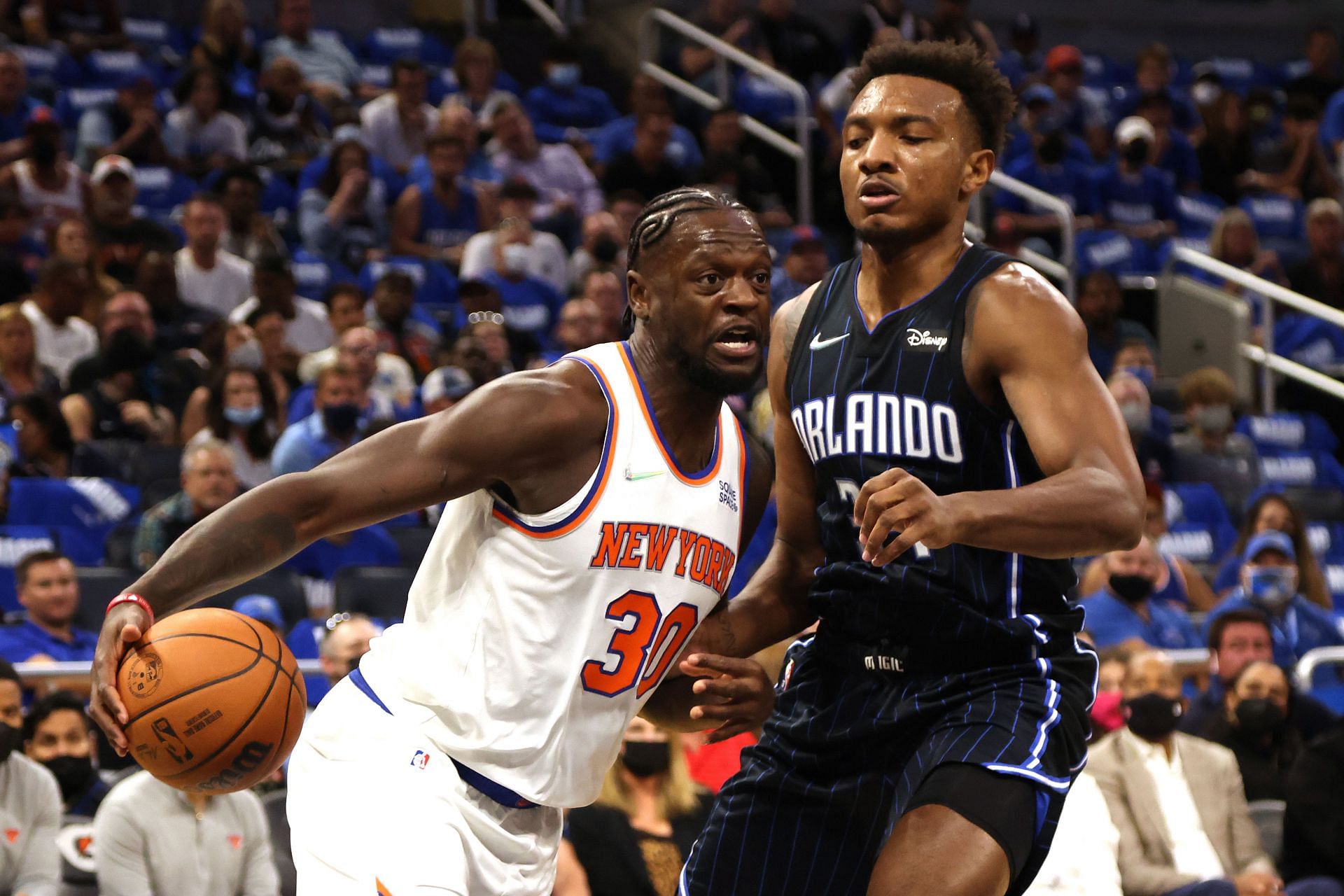 Julius Randle of the New York Knicks drives against Wendell Carter Jr. of the Orlando Magic