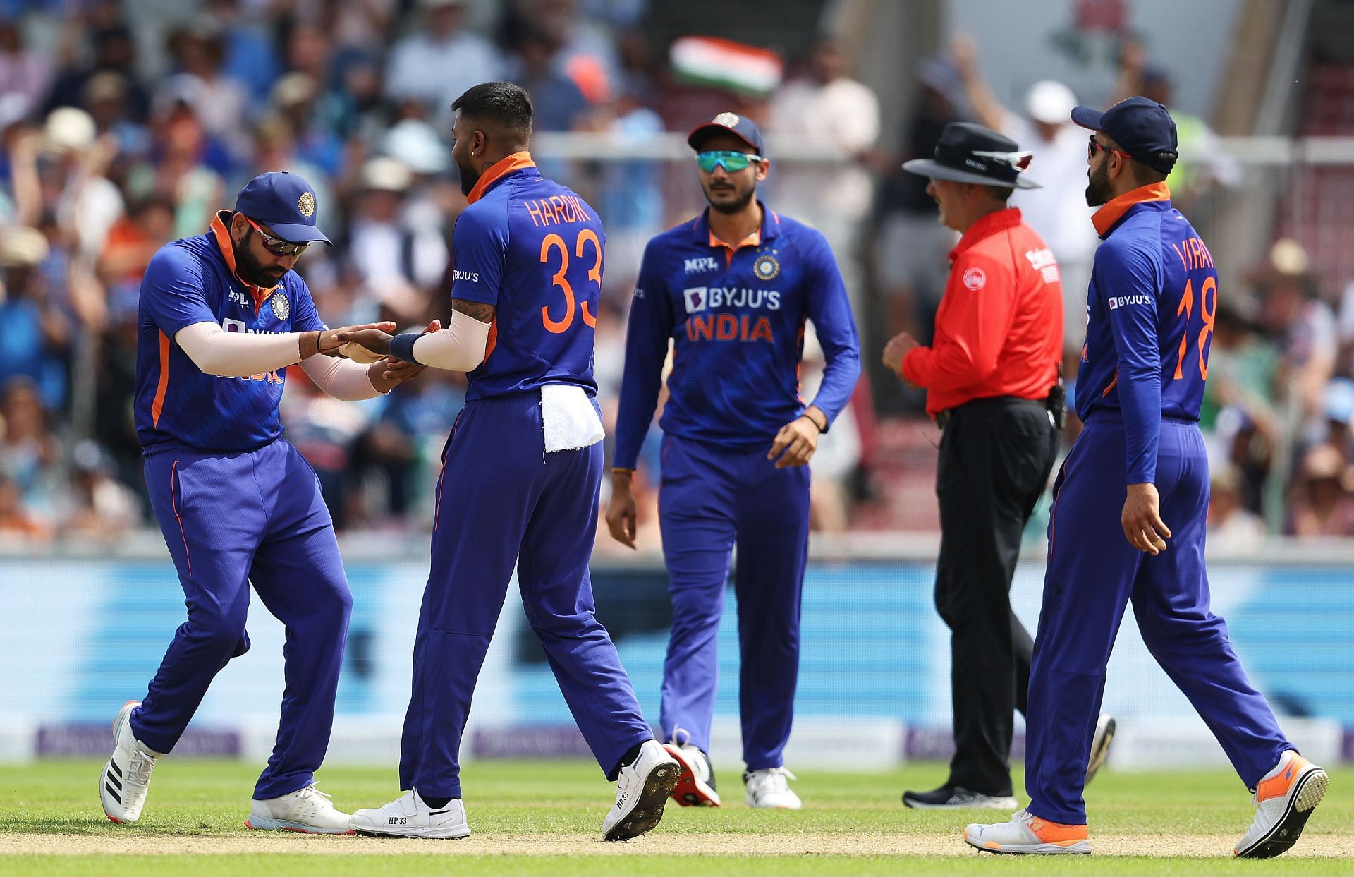 Rohit Sharma congratulates Hardik Pandya of India on the wicket of Liam Livngstone. Pic: Getty Images