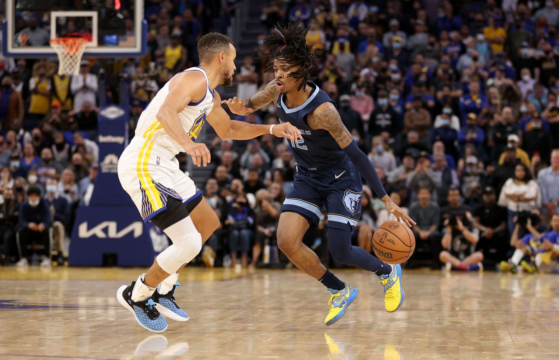 Ja Morant of the Memphis Grizzlies against Steph Curry of the Golden State Warriors