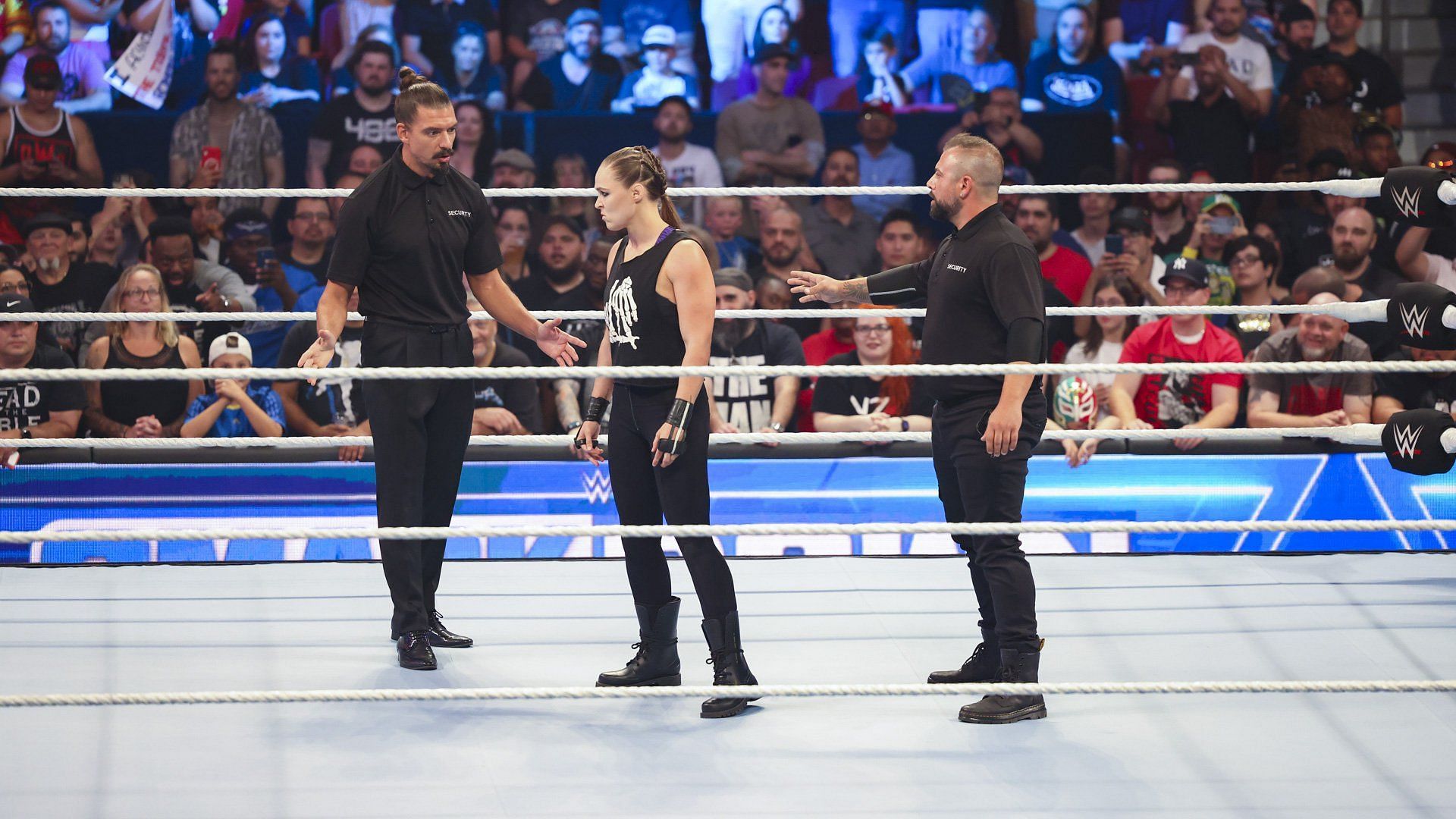 Ronda Rousey confronts security deployed by Adam Pearce