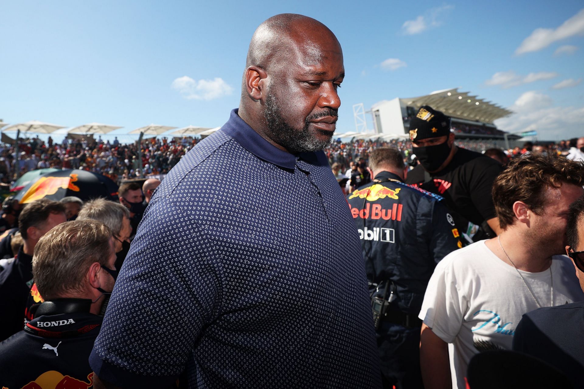 Shaquille O'Neal walks on the grid before the F1 Grand Prix of the USA