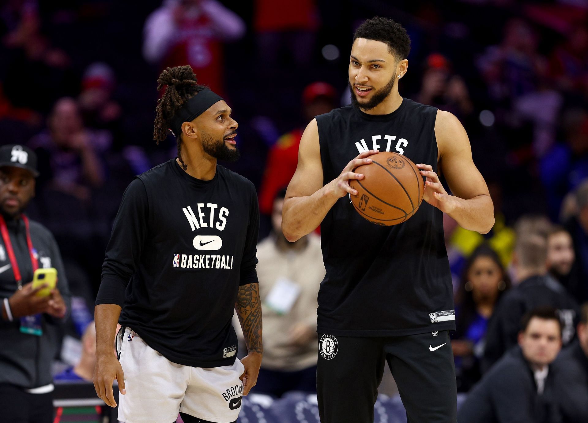 Patty Mills, left, and Ben Simmons of the Brooklyn Nets