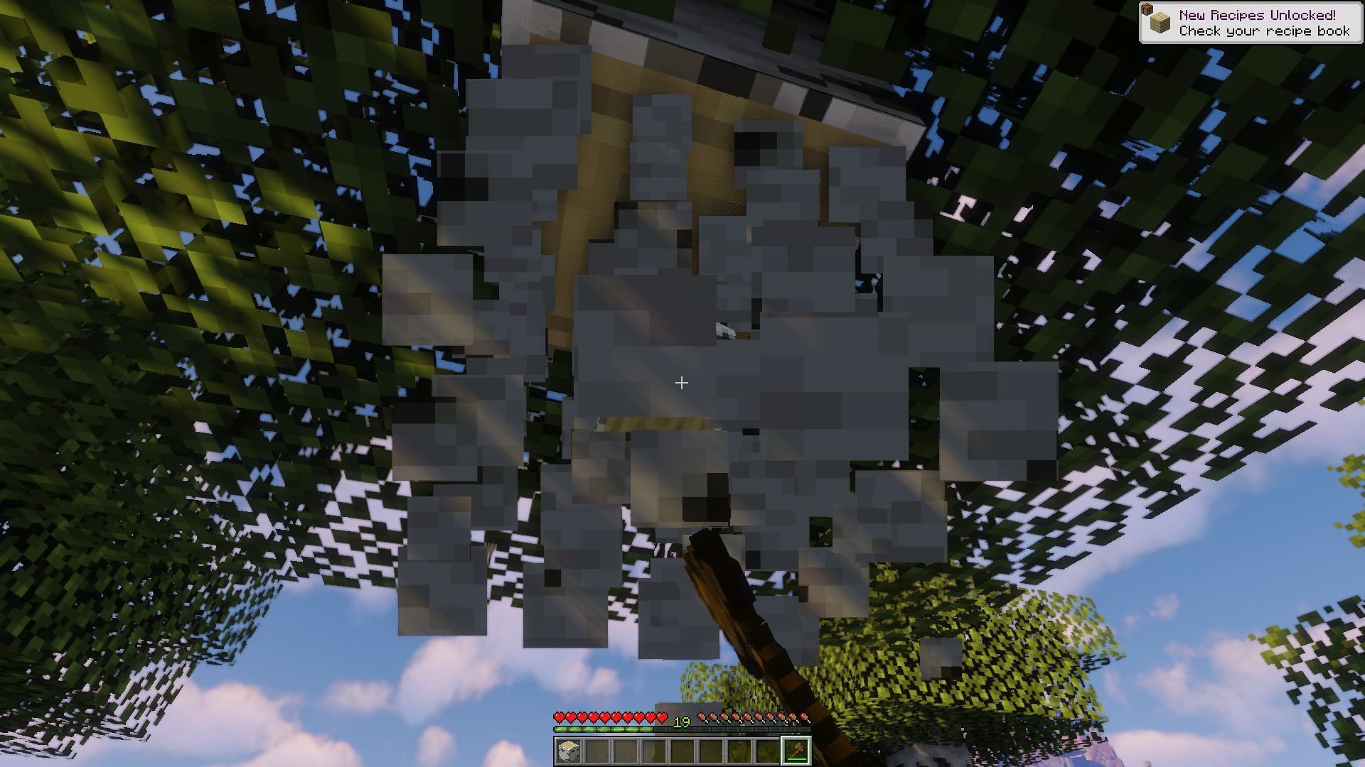 A player harvesting a birch tree for wood (Image via Minecraft)