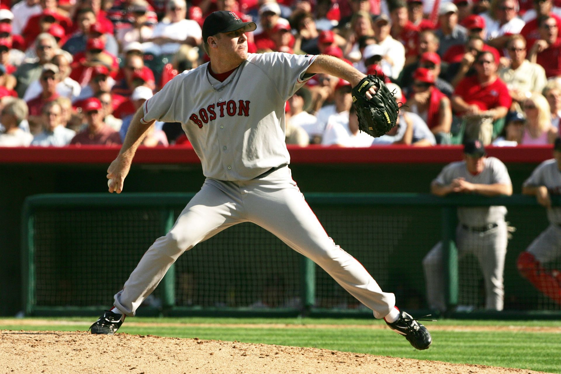 Pitcher Curt Schilling delivers a pitch during the American League Division Series in Anaheim.