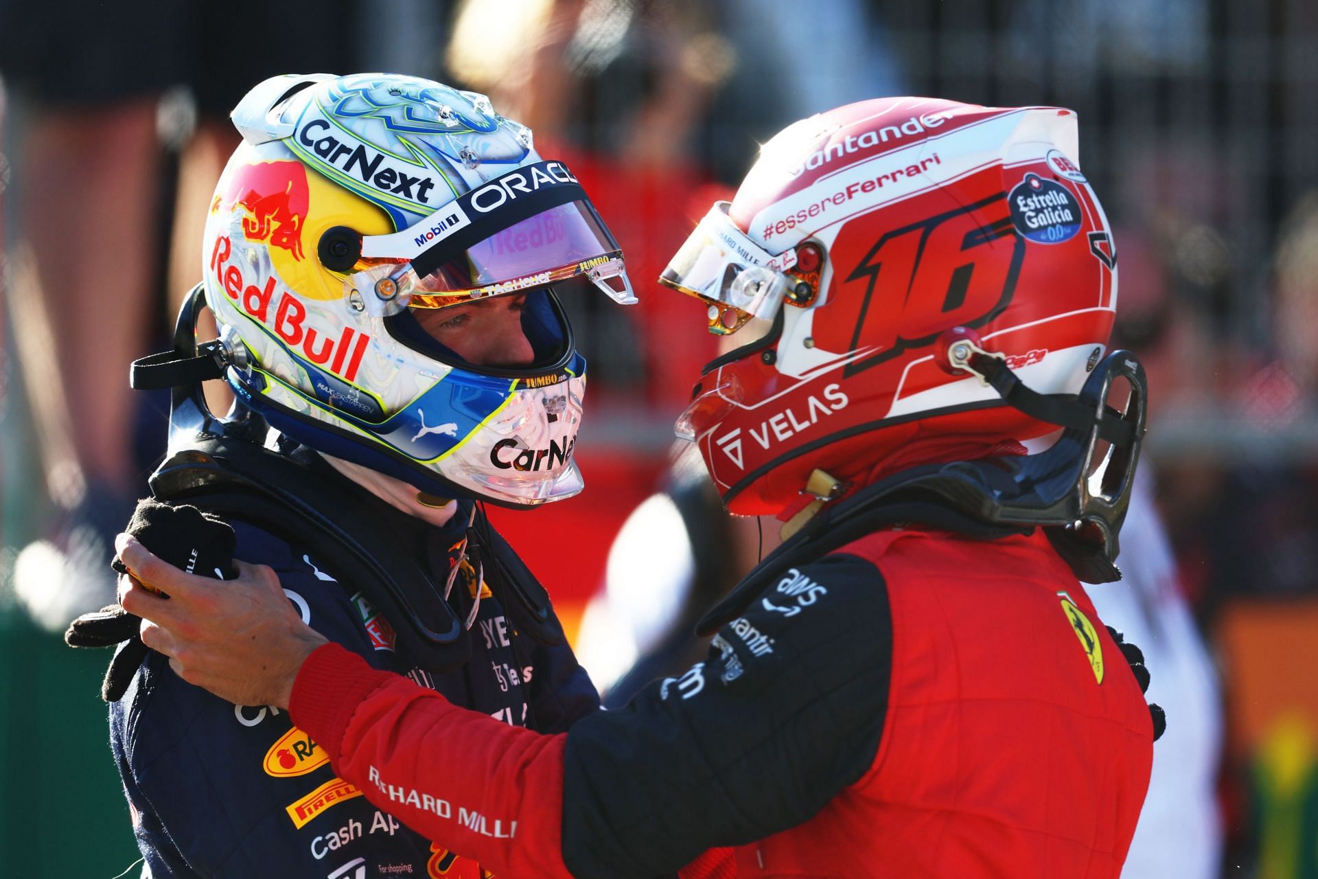 Red Bull driver Max Verstappen (left) and Ferrari driver Charles Leclerc share a moment after qualifying for the 2022 F1 Austrian GP (Photo by Clive Rose/Getty Images)