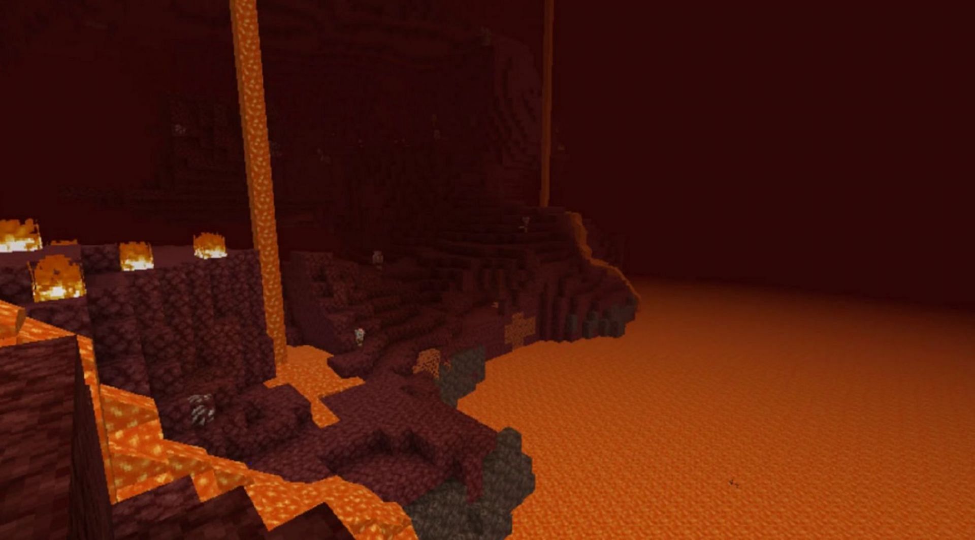 A cliff leading to a lava pool in the Nether wastes (Image via Mojang)