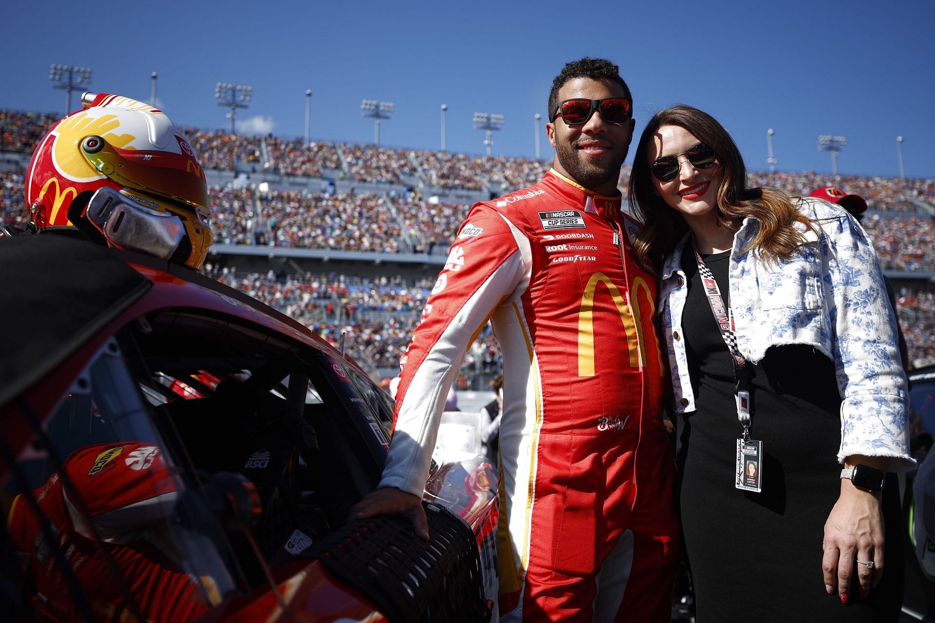 Bubba Wallace Jr. and fiance Amanda Carter on the grid before the 2022 NASCAR Cup Series 64th Annual Daytona 500 at Daytona International Speedway in Daytona Beach, Florida. (Photo by Jared C. Tilton/Getty Images)