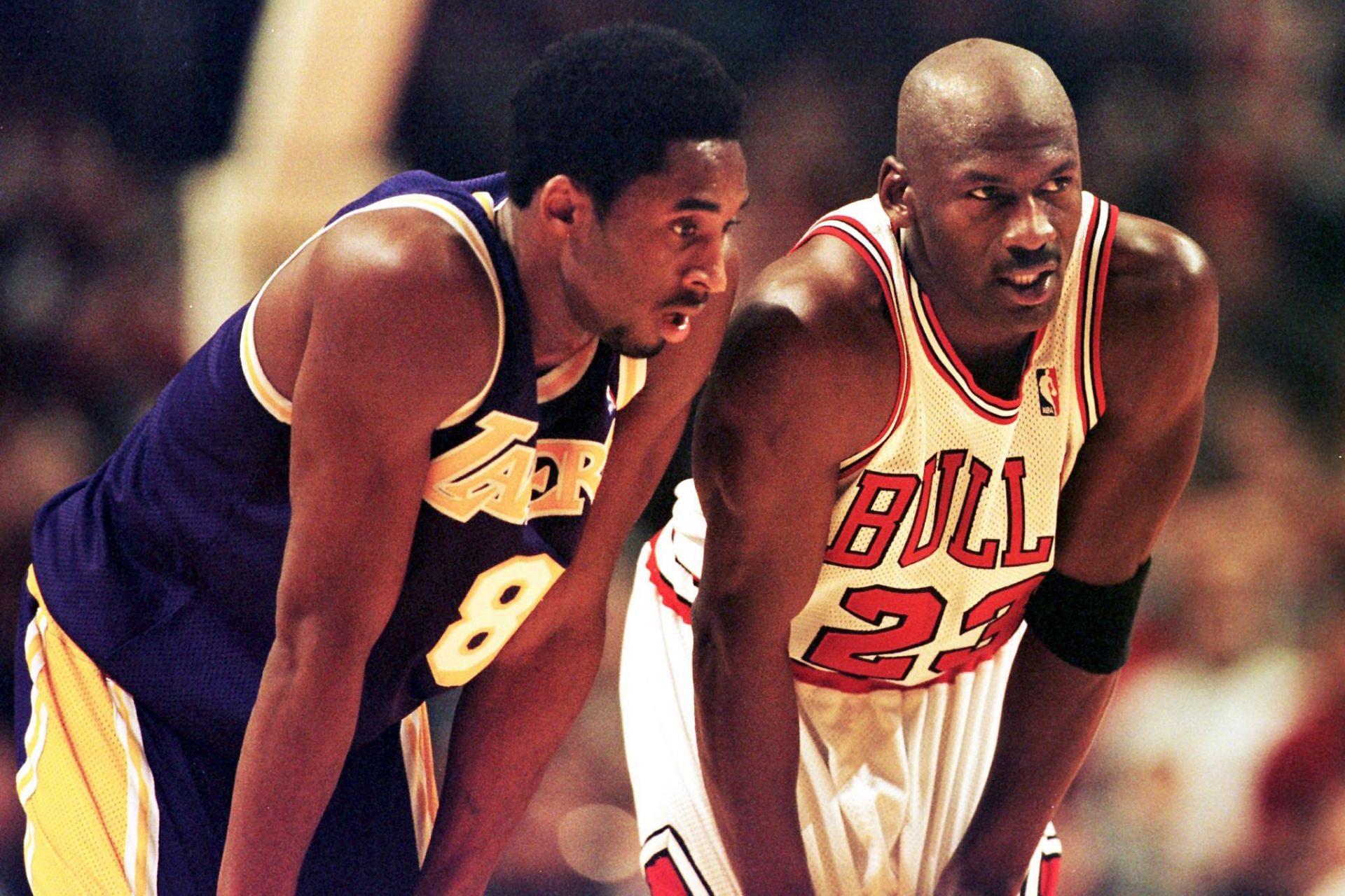 NBA legends Kobe Bryant and Michael Jordan on the court together.