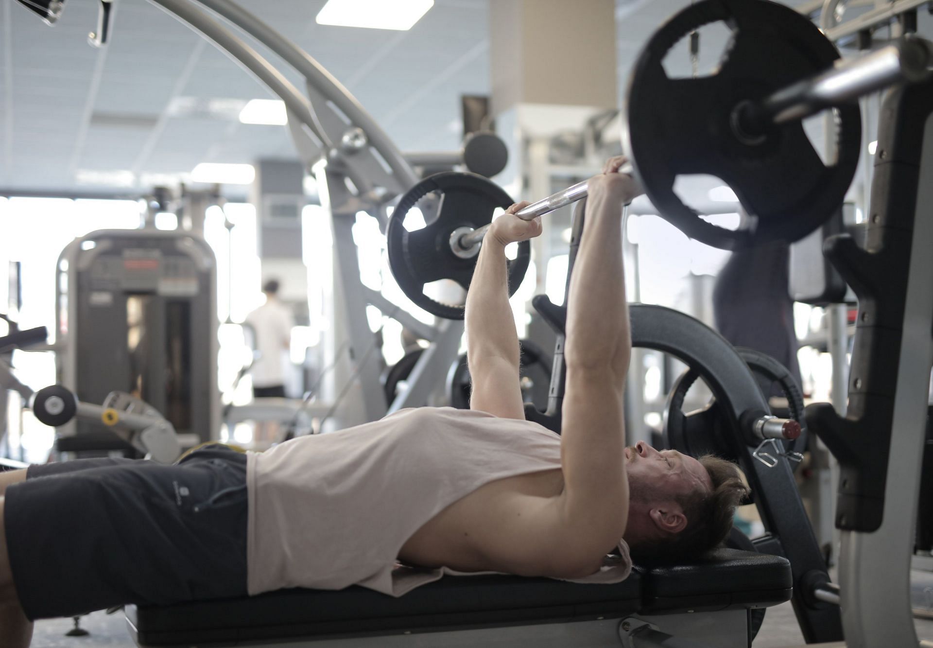 Strengthening your triceps can significantly increase your bench press strength (Image via Pexels @Andrea Piacquadio)