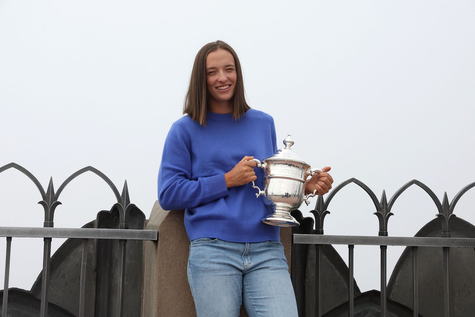 Iga Swiatek of Poland poses with the US Open trophy at Top of the Rock at the 2022 US Open Champions Portraits