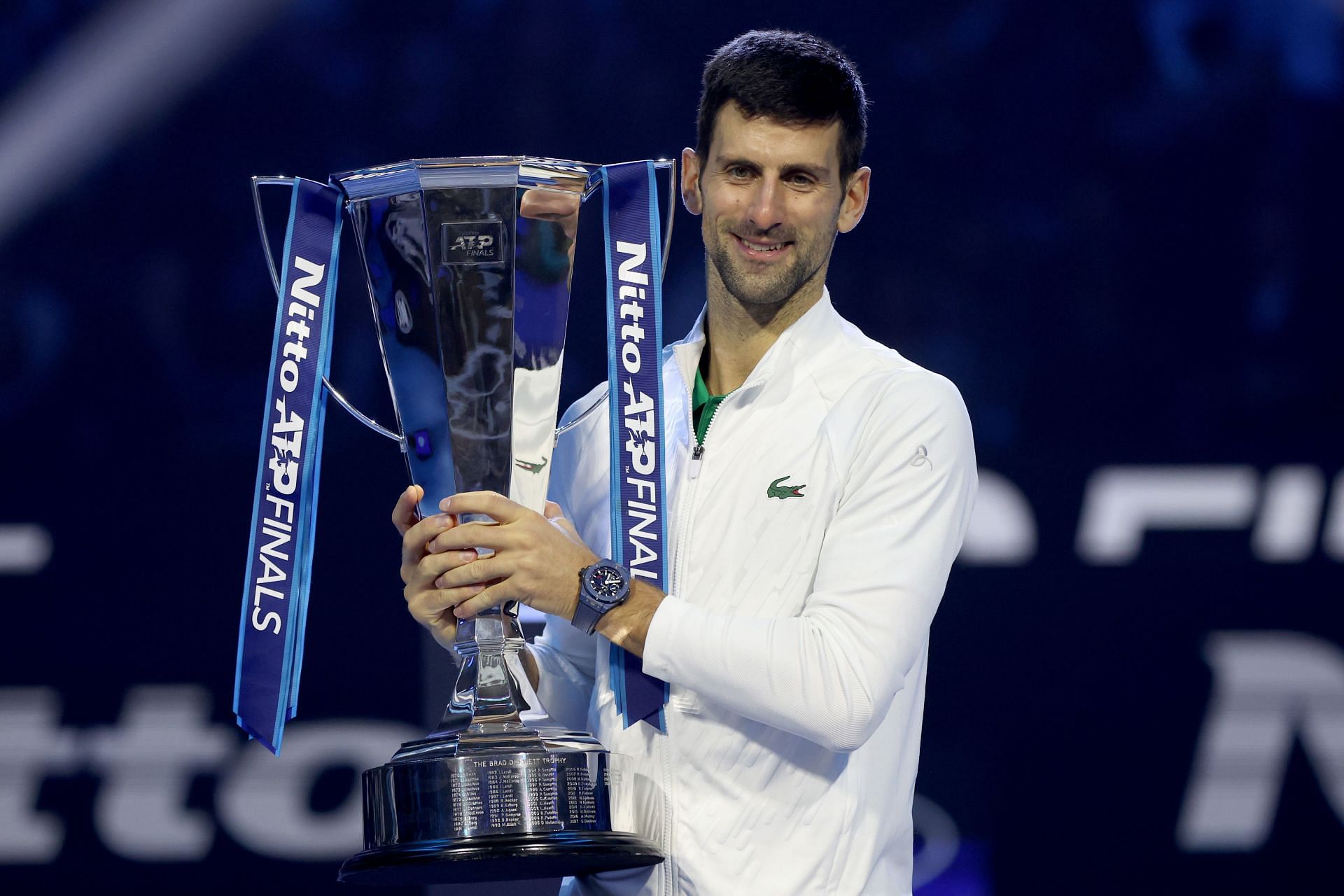 Novak Djokovic pictured with the 2022 Nitto ATP Finals trophy