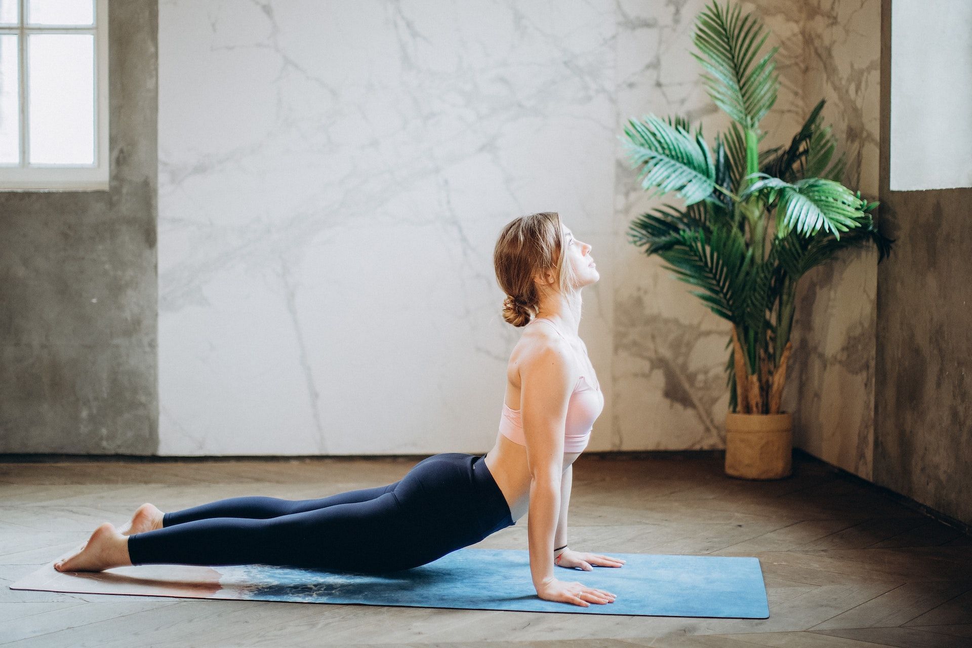 Yoga poses help ease chronic pain. (Photo via Pexels/Elina Fairytale)