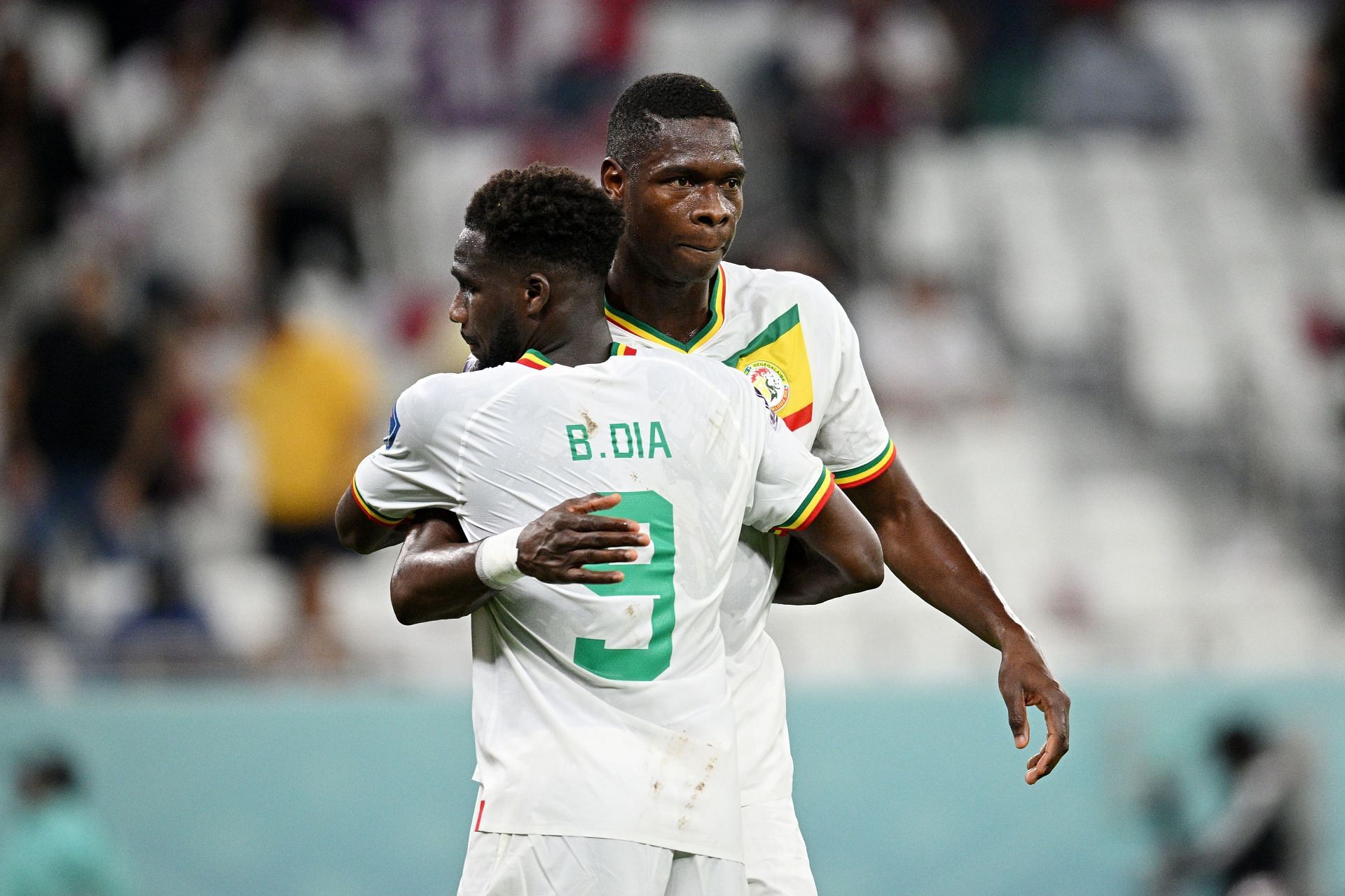 Boulaye Dia (L) and Pape Abou Cisse celebrate Senegal&#039;s 3-1 win against Qatar.