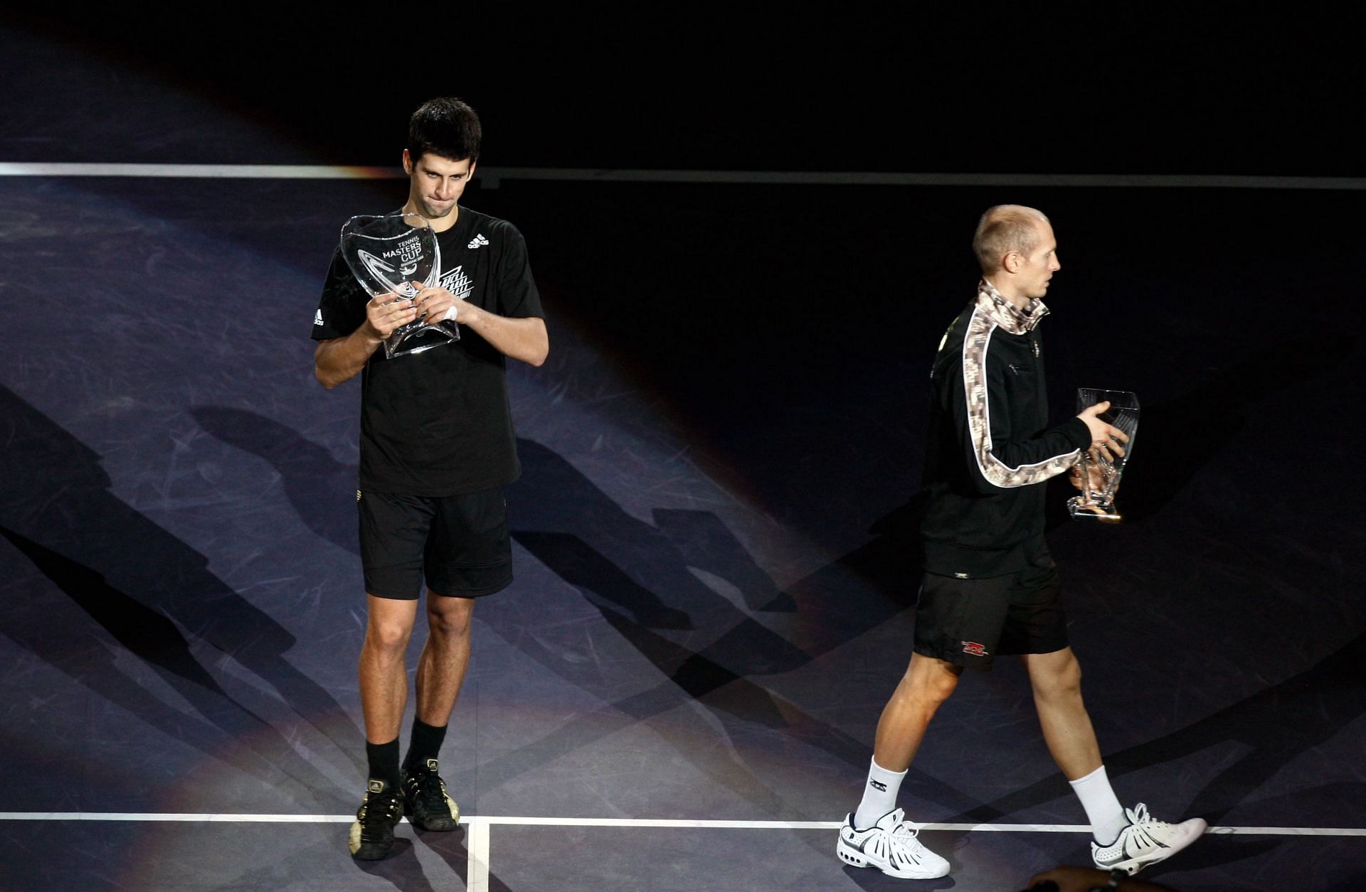 Novak Djokovic [left] after winning the Tennis Masters Cup against Nikolay Davydenko in 2008.