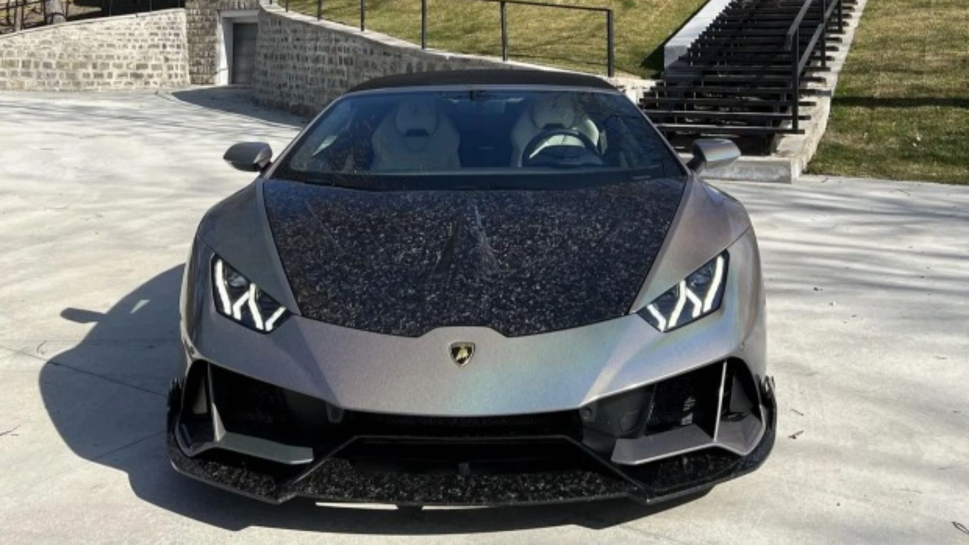 Tate's black and silver Lamborghini Huracan Spyder worth $225,000 (Image via Instagram)
