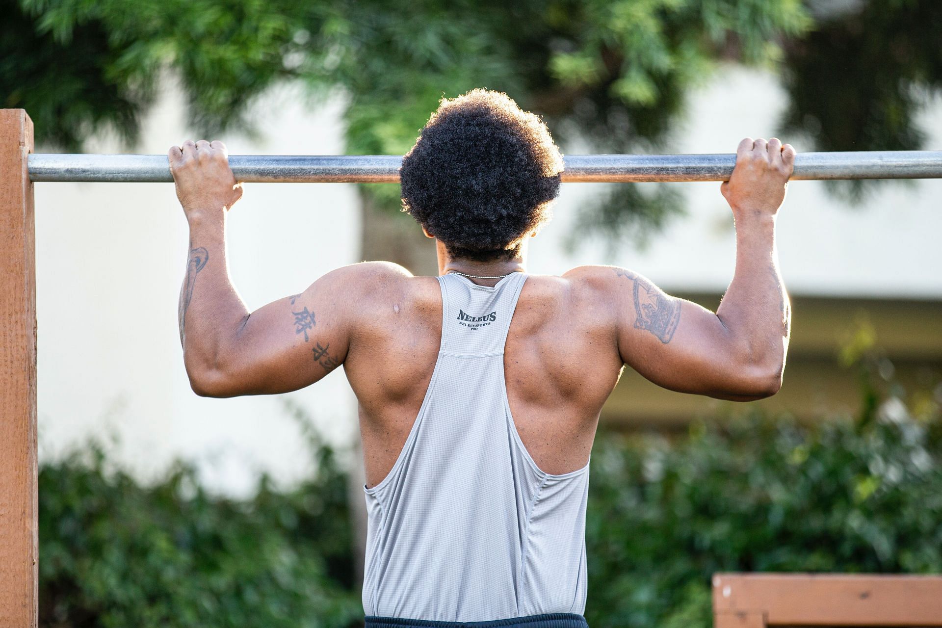 Butterfly pull-up increases strength, speed, and strength endurance. (Image via Unsplash/ Lawrence Crayton)