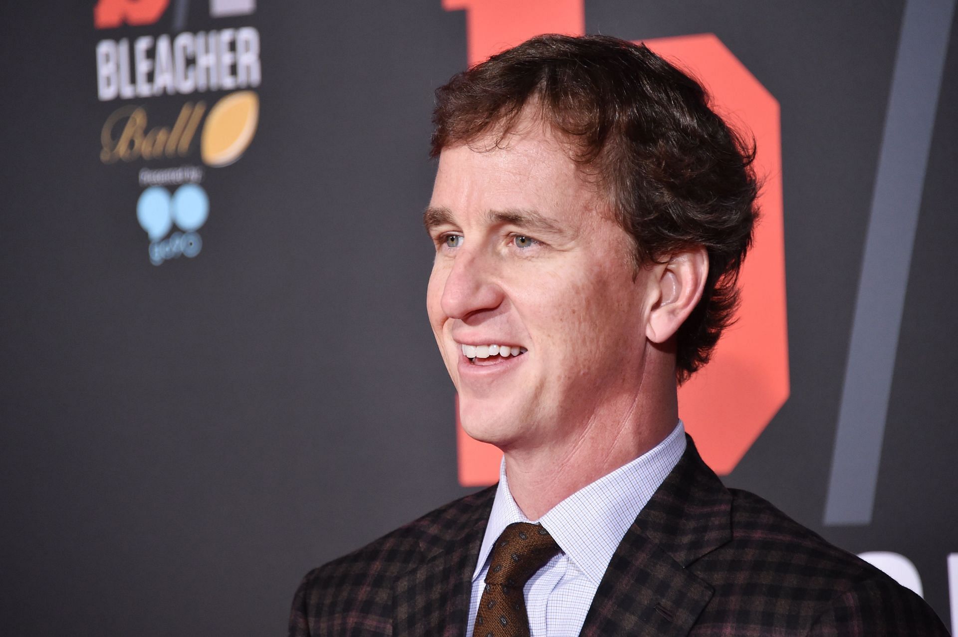 How many children does Cooper Manning have, and what do they do?