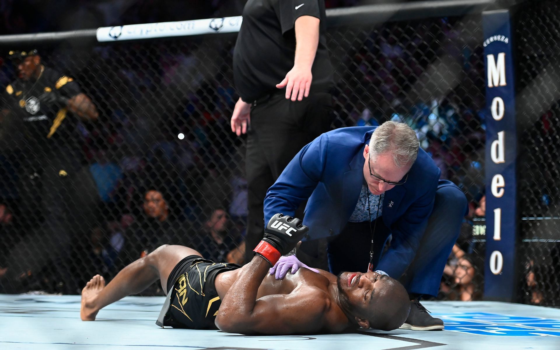 Kamaru Usman on the canvas after being knocked out by Leon Edwards