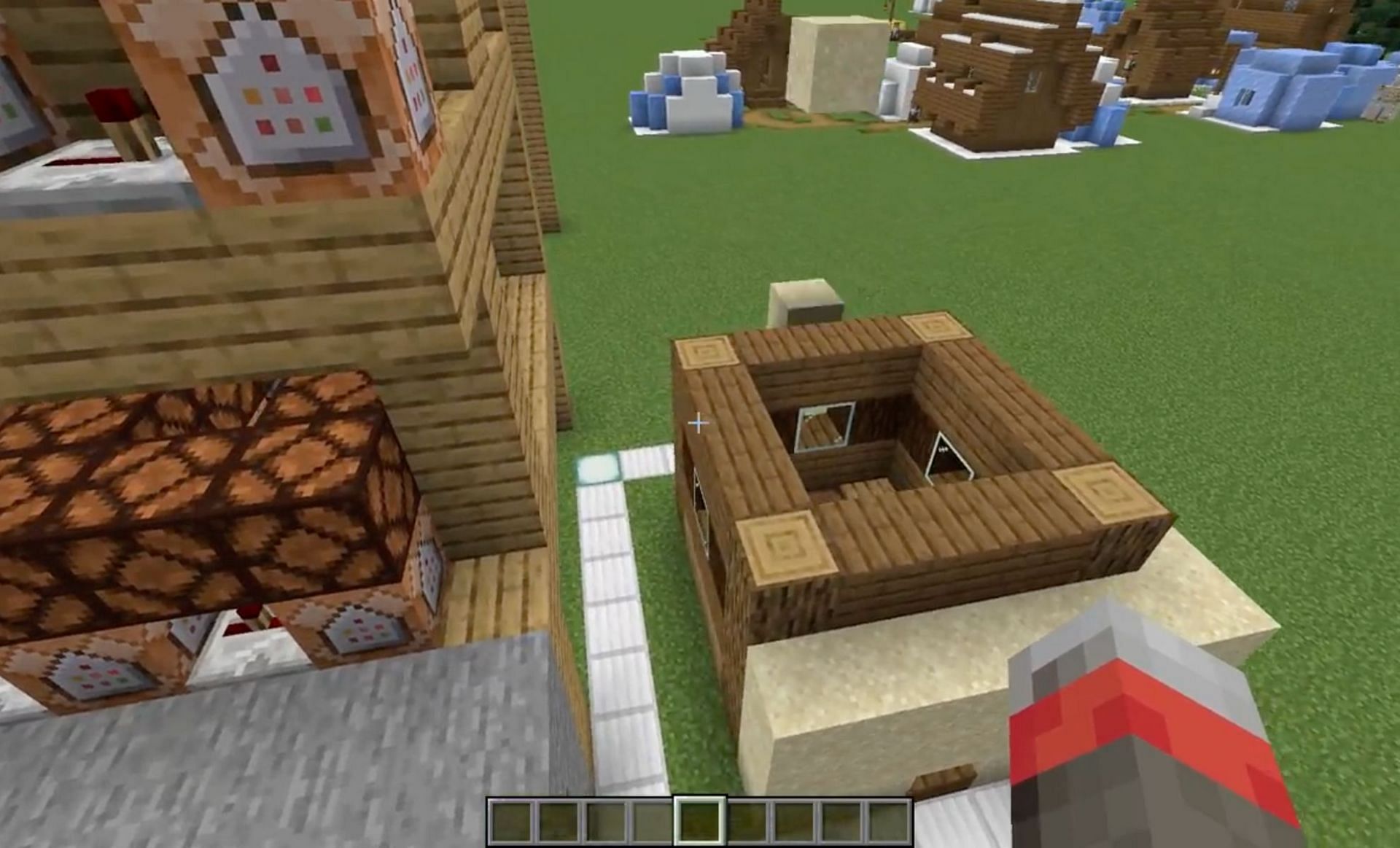 Minecraft player uses command blocks to automatically build house