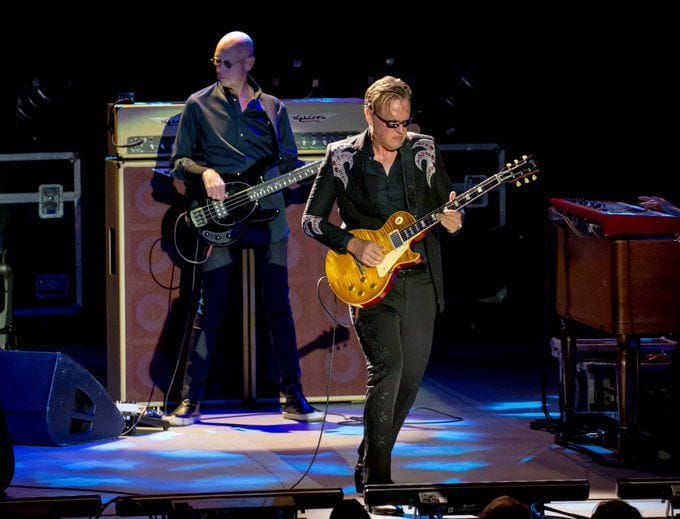 Who was Michael Rhodes? Tributes pour in as bass player dies aged 69