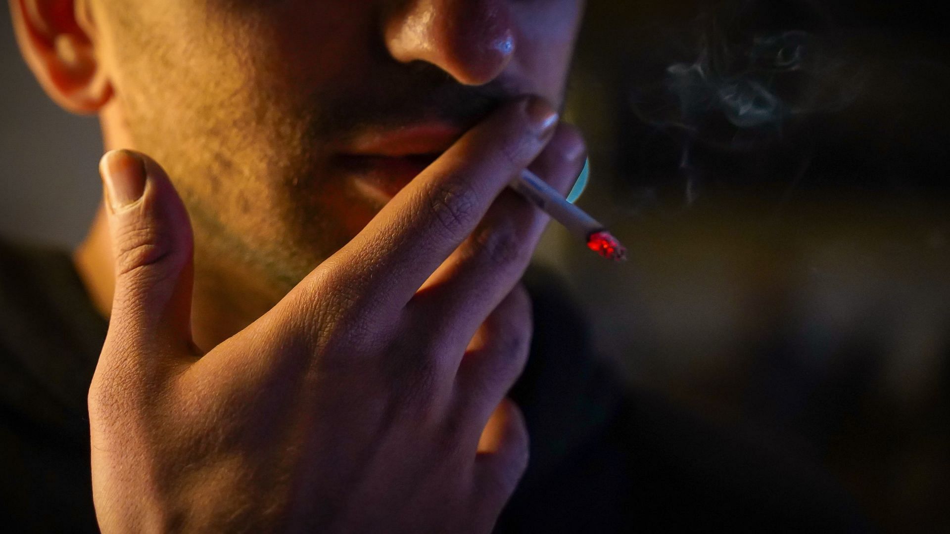 Tobacco can cause bad breath. (Image via Unsplash / Reza Mehrad)