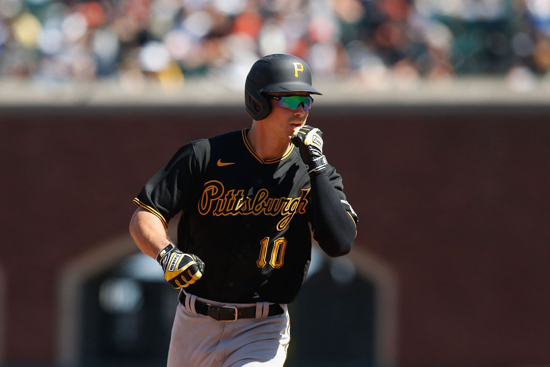 Bryan Reynolds of the Pittsburgh Pirates rounds the bases after hitting a three-run home run.