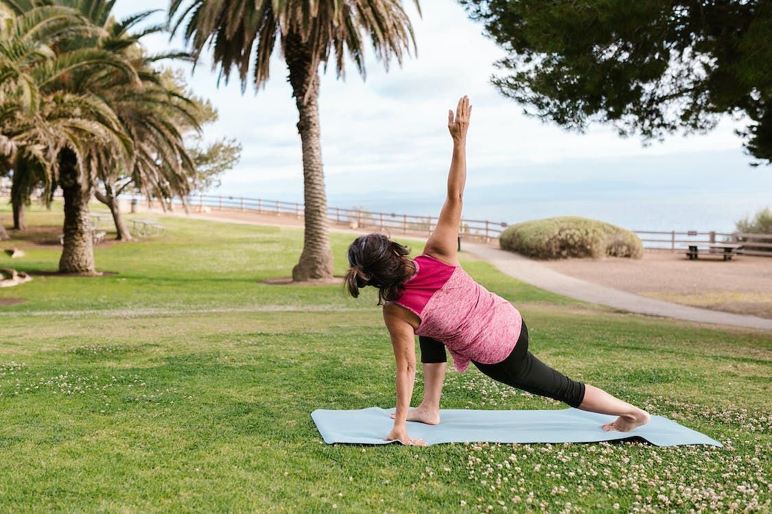 This yoga pose stretches the hamstrings, hips and spine. (Photo via Pexels/RODNAE Productions)