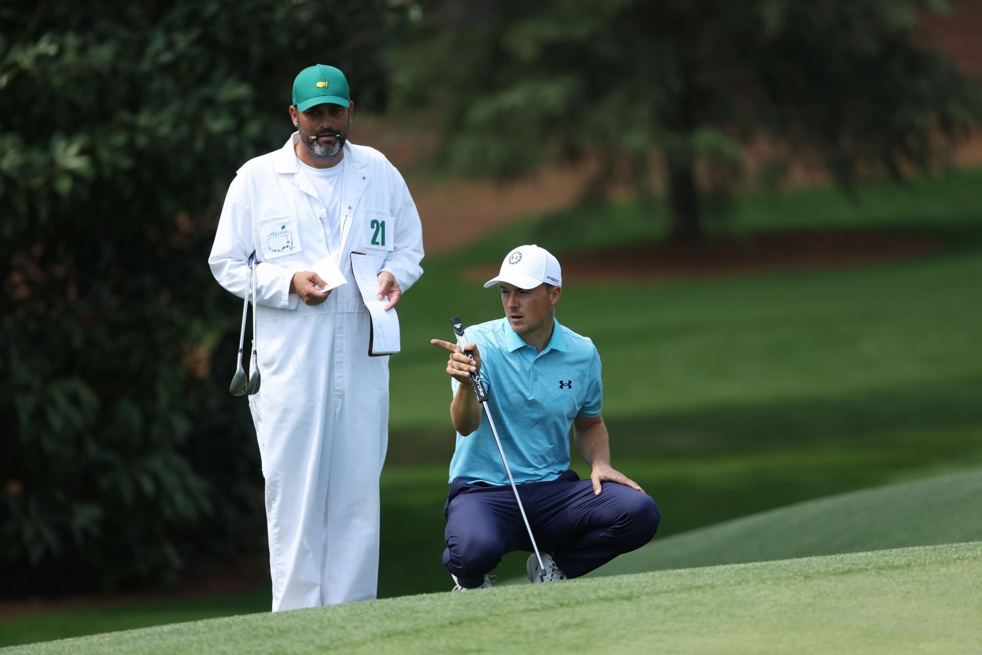 Why do caddies wear white boiler suits at the Masters?