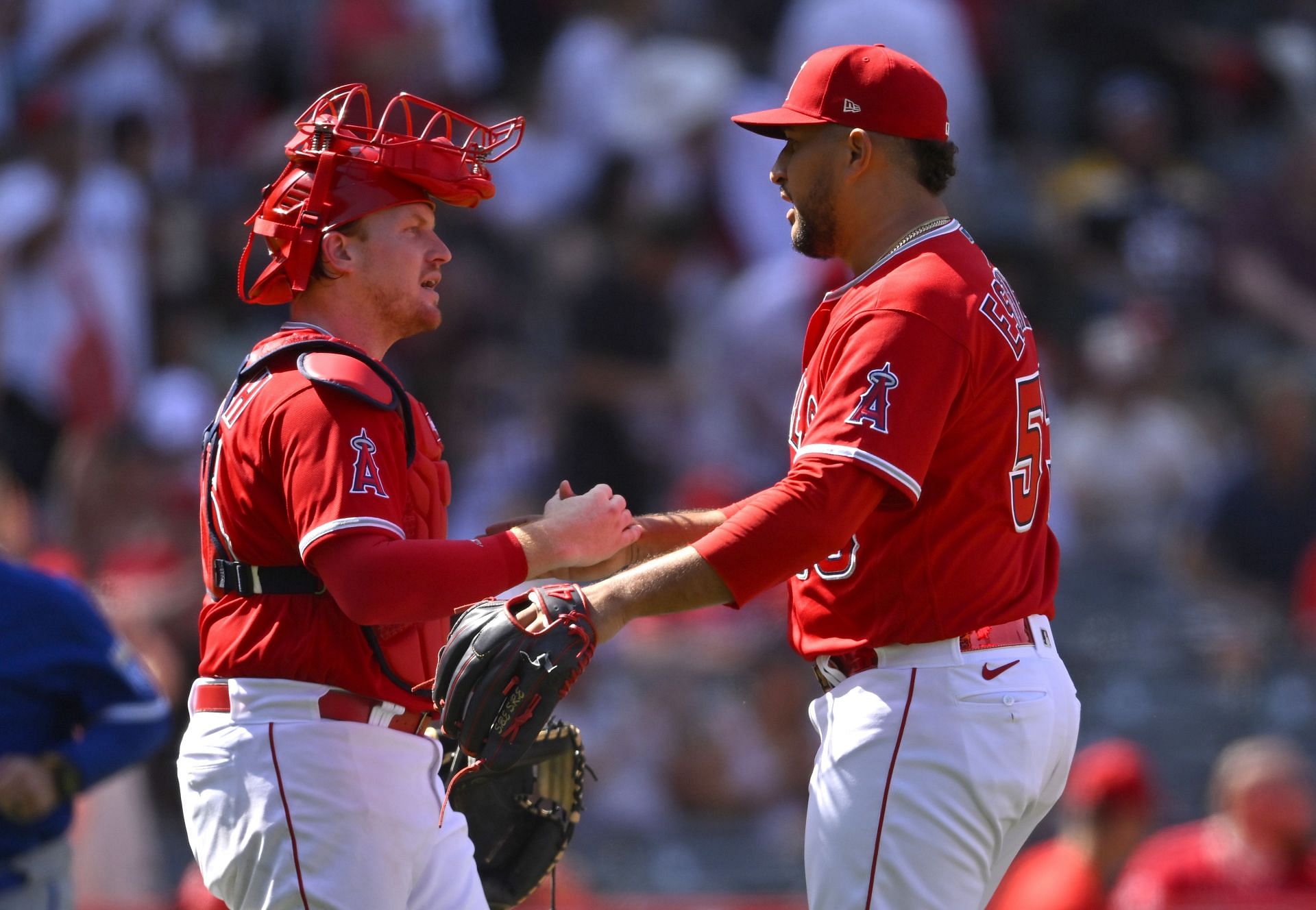 Carlos Estevez is congratulated by catcher Chad Wallach #35 of the Los Angeles Angels
