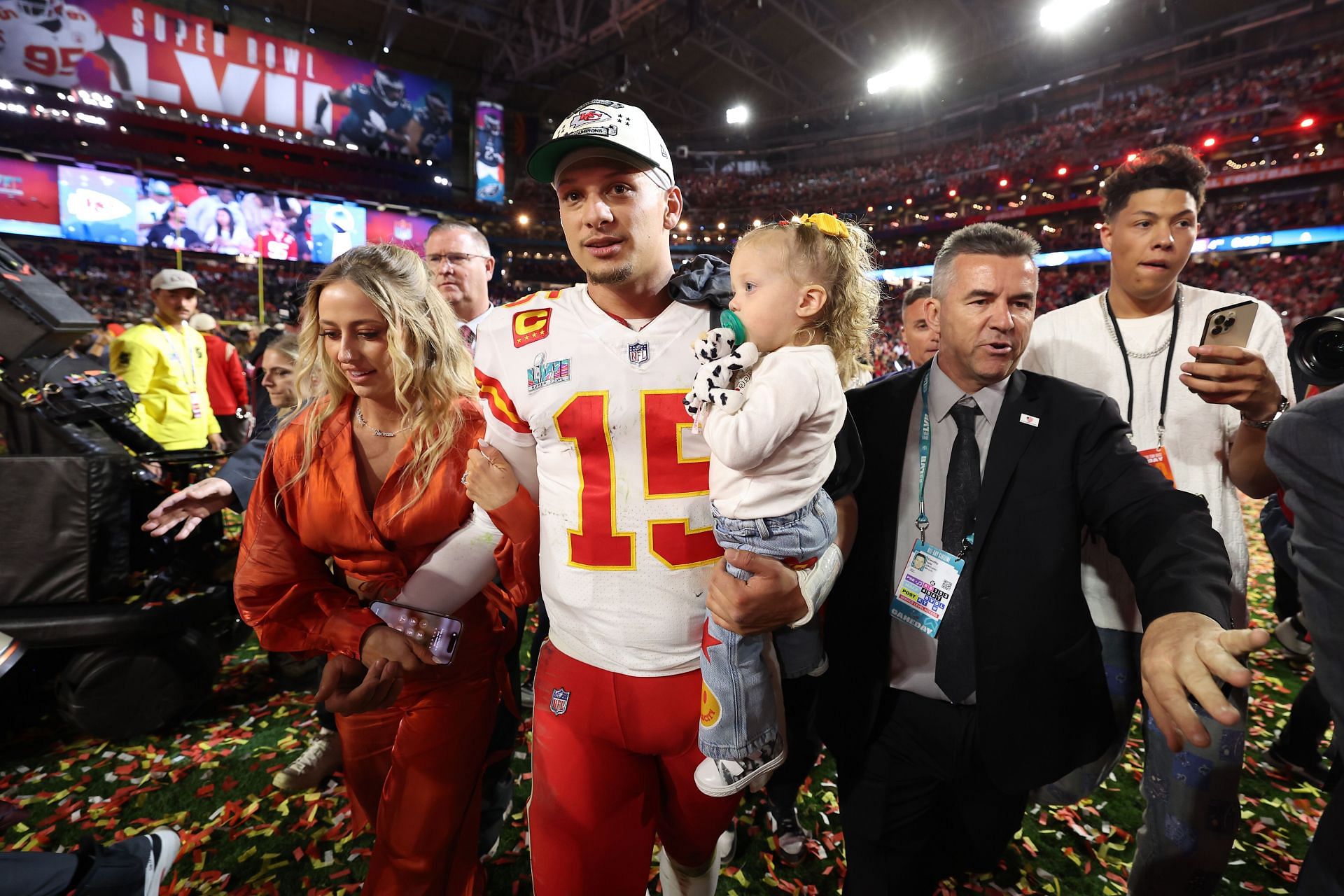 The couple with their daughter after the Chiefs won Super Bowl LVII