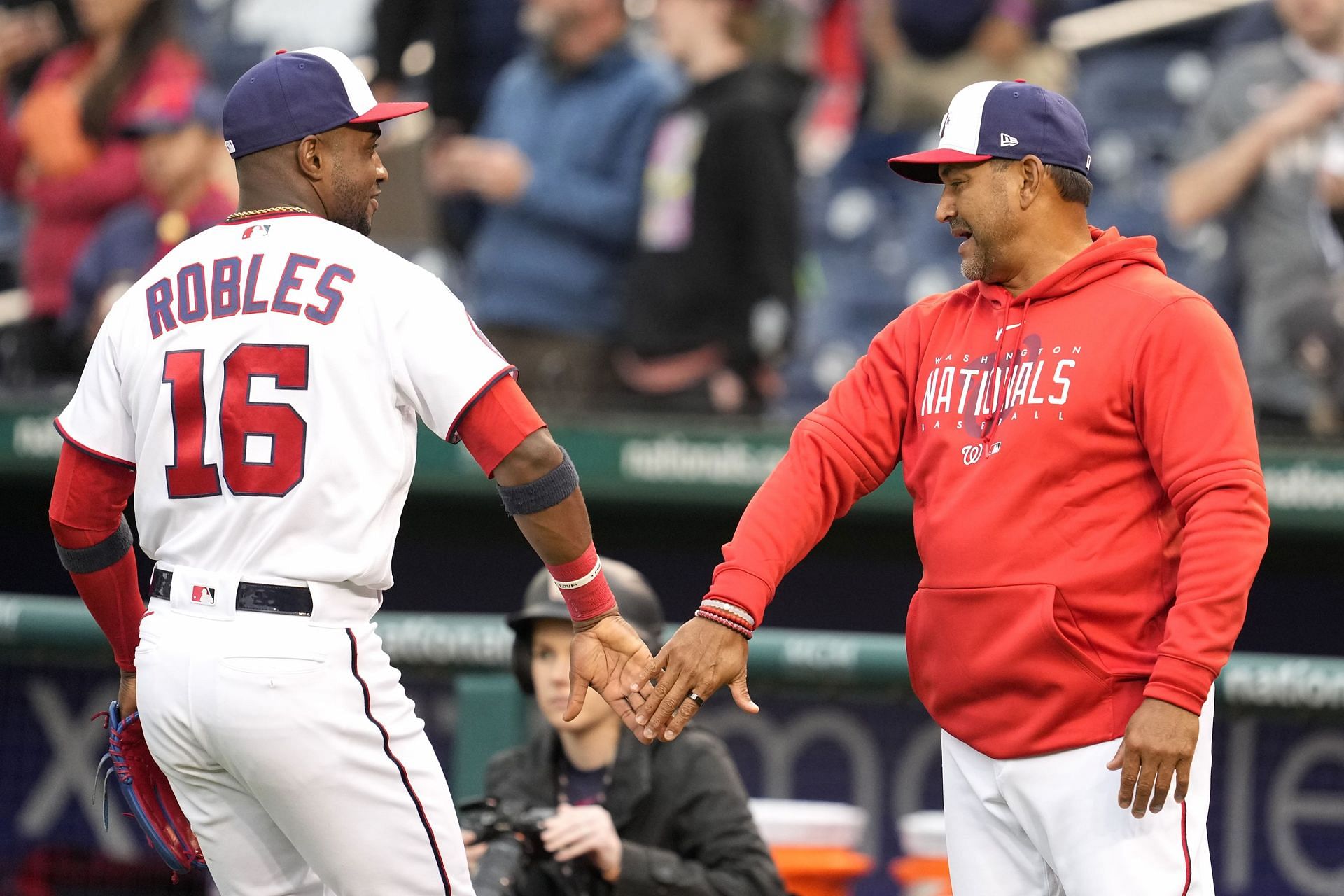Victor Robles of the Washington Nationals celebrates a win with manager Dave Martinez