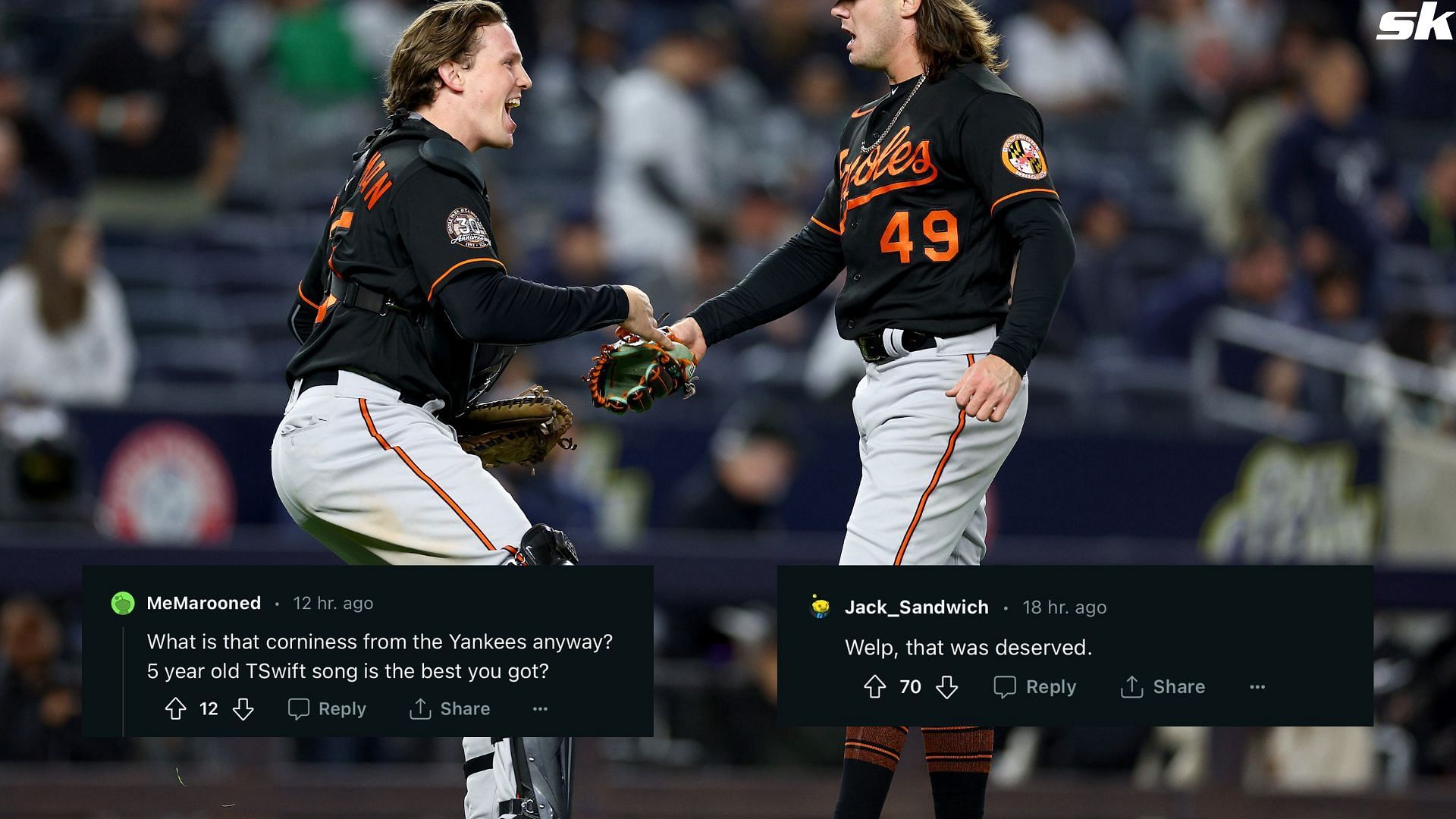 Adley Rutschman and DL Hall of the Baltimore Orioles celebrate the win over the New York Yankees