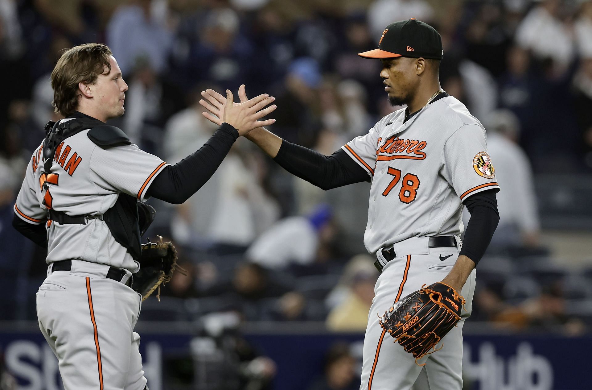 Adley Rutschman, left, and Yennier Cano of the Baltimore Orioles celebrate after defeating the New York Yankees at Yankee Stadium.