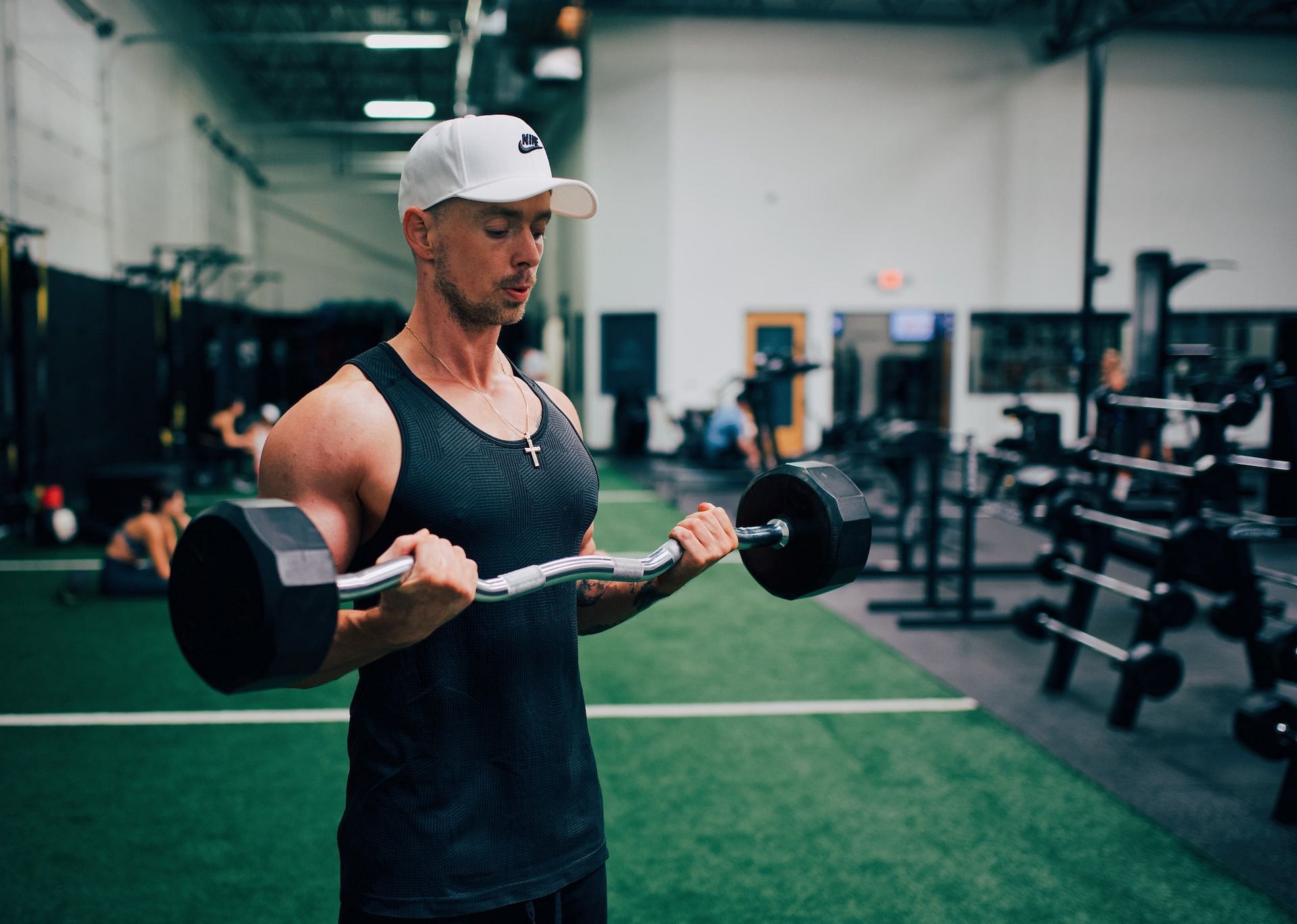 Incorporate EZ bar curls to your arms routine for muscular and toned biceps