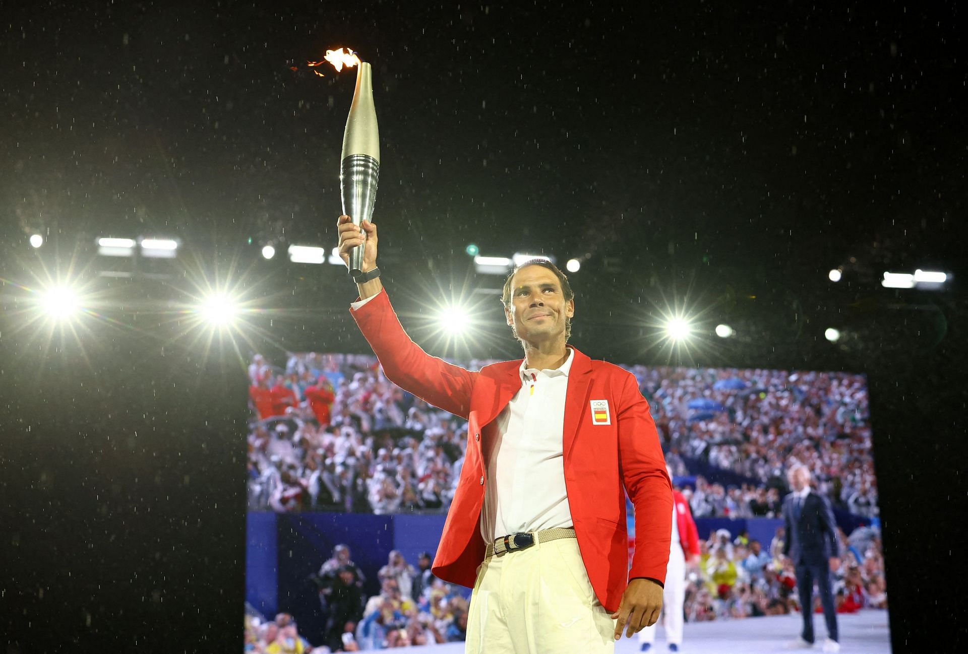PICTURE: Rafael Nadal's stunning Paris Olympics update of him carrying the Olympic torch under a glittering Eiffel Tower goes viral