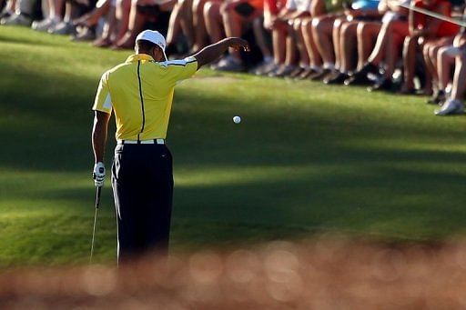 Tiger Woods drops his ball on the 15th hole during the second round of the Augusta National on April 12, 2013
