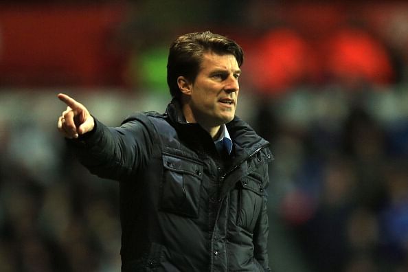 SWANSEA, WALES - DECEMBER 22: Michael Laudrup the Swansea manager reacts during the Barclays Premier League match between Swansea City and Everton at the Liberty Stadium on December 22, 2013 in Swansea, Wales.  (Photo by Richard Heathcote/Getty Images)