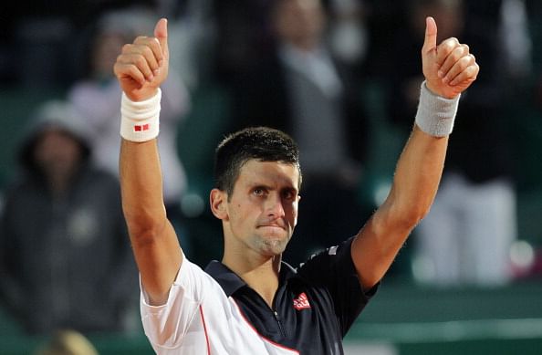 Novak Djokovic celebrates after winning his Monte-Carlo match against Guillermo Garcia-Lopez