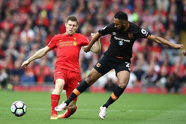 LIVERPOOL, ENGLAND - SEPTEMBER 24: James Milner of Liverpool (L) and Ahmed Elmohamady of Hull City (R) battle for possession during the Premier League match between Liverpool and Hull City at Anfield on September 24, 2016 in Liverpool, England.  (Photo by Julian Finney/Getty Images)