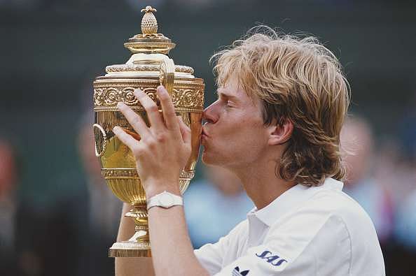 Stefan Edberg of Sweden kisses trophy as he celebrates defeating Boris Becker in the Men&#039;s Singles Final of the Wimbledon Lawn Tennis Championship on 4 July 1988 at the All England Lawn Tennis and Croquet Club in Wimbledon, London, England. (Photo by Steve Powell/Getty Images)