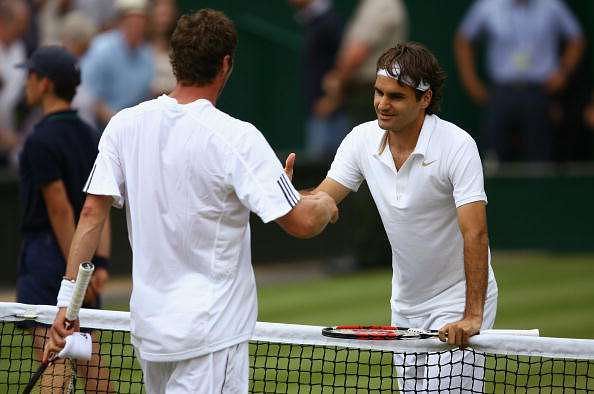 LONDON - JULY 04:  Roger Federer of Switzerland is congratulated on winning the men&#039;s singles Semi Final match by Marat Safin of Russia on day eleven of the Wimbledon Lawn Tennis Championships at the All England Lawn Tennis and Croquet Club on July 4, 2008 in London, England.  (Photo by Clive Brunskill/Getty Images)