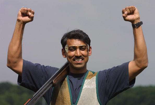 BISLEY - AUGUST 1:  Rajyavardhan Singh of India celebrates winning gold in the Men&#039;s Double Trap Singles Final during the 2002 Commonwealth Games in Bisley, England on August 1, 2002. (Photo by Craig Prentis/Getty Images)   