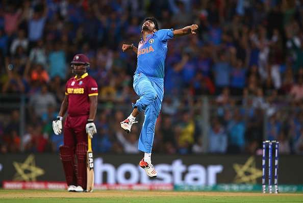 MUMBAI, INDIA - MARCH 31: Jasprit Bumrah of India celebrates after taking the wicket of Chris Gayle of the West Indies  during the ICC World Twenty20 India 2016 Semi Final match between West Indies and India at Wankhede Stadium on March 31, 2016 in Mumbai, India.  (Photo by Ryan Pierse/Getty Images)