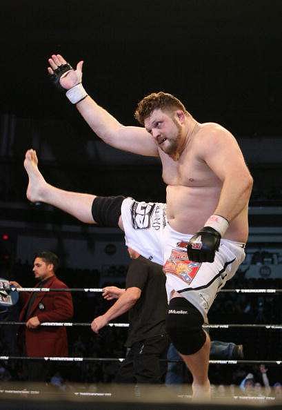 LAS VEGAS - FEBRUARY 29:  Roy Nelson white trunks of Lion&#039;s Den celebrates his victory over Fabiano Scherner red trunks of Team Quest during their Heavyweight title bout at The Orleans Arena on February 29, 2008 in Las Vegas, Nevada.  (Photo by Ethan Miller/Getty Images)