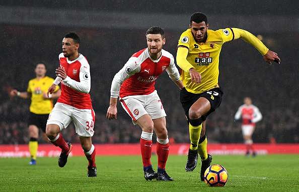 LONDON, ENGLAND - JANUARY 31: Etienne Capoue of Watford goes past Shkodran Mustafi of Arsenal during the Premier League match between Arsenal and Watford at Emirates Stadium on January 31, 2017 in London, England.  (Photo by Mike Hewitt/Getty Images)