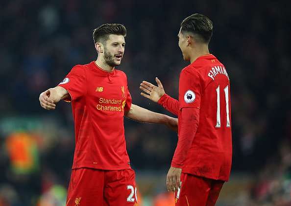 LIVERPOOL, ENGLAND - FEBRUARY 11: Adam Lallana of Liverpool celebrates with Roberto Firmino after the Premier League match between Liverpool and Tottenham Hotspur at Anfield on February 11, 2017 in Liverpool, England.  (Photo by Clive Brunskill/Getty Images)