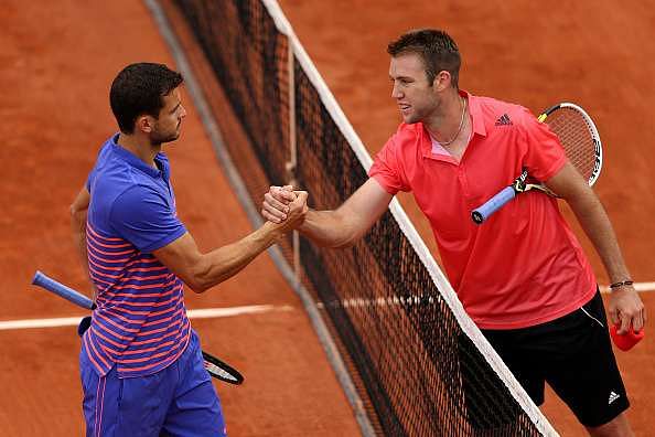 PARIS, FRANCE - MAY 26:  Jack Sock of the United States is congratulated on victory at the net by Grigor Dimitrov of Bulgaria after their Men&#039;s Singles match on day three of the 2015 French Open at Roland Garros on May 26, 2015 in Paris, France.  (Photo by Clive Brunskill/Getty Images)