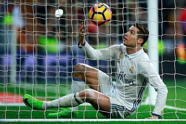 MADRID, SPAIN - MARCH 01: Cristiano Ronaldo of Real Madrid CF picks the ball after scoring their second goal during the La Liga match between Real Madrid CF and UD Las Palmas at Estadio Santiago Bernabeu on March 1, 2017 in Madrid, Spain.  (Photo by Gonzalo Arroyo Moreno/Getty Images)